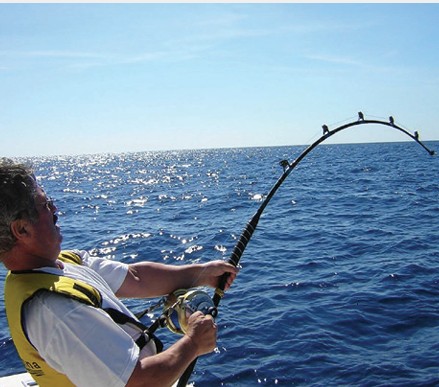 A person fishing on a boat off northern Zanzibar